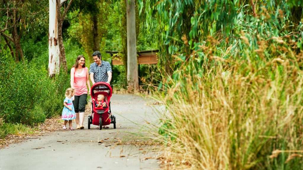 Young family walking in a park